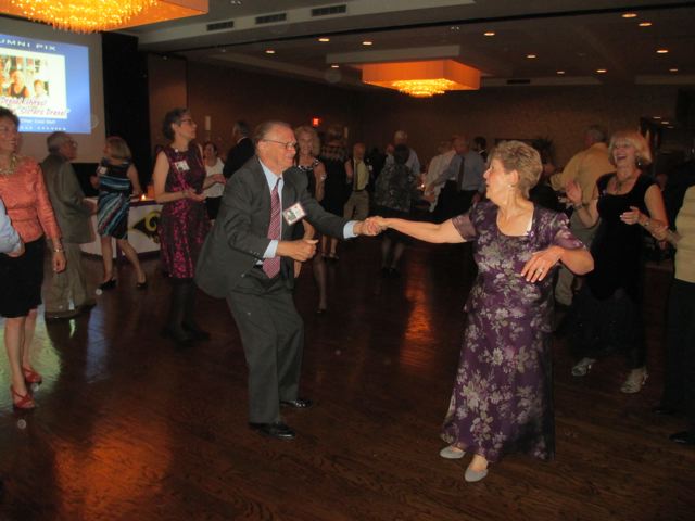On the Dance Floor: Stan Cracovia and Rita Naclerio being cheered on by Joan Drexel